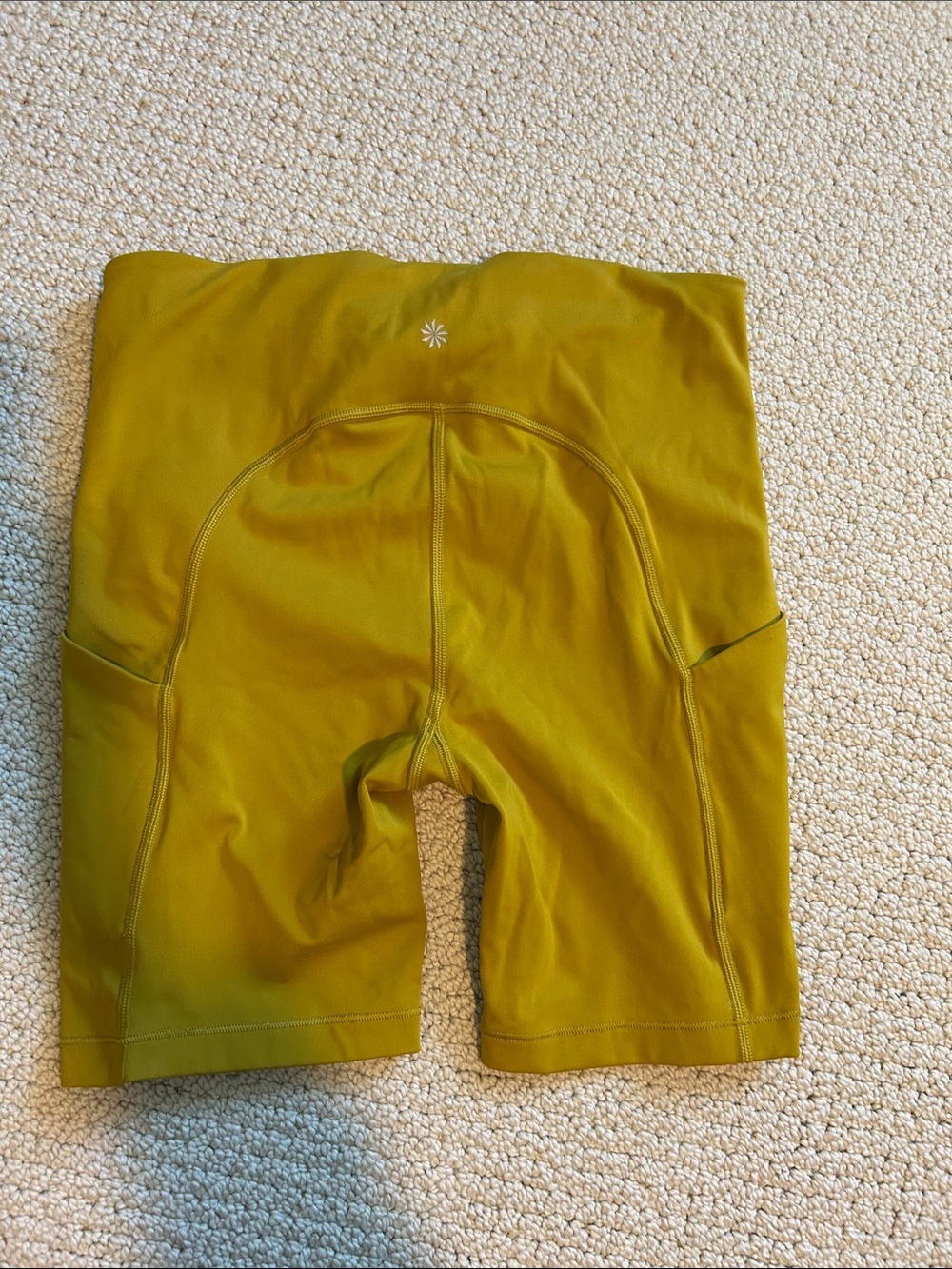 Athleta Ultimate Stash 7in Bike Shorts in Mustard